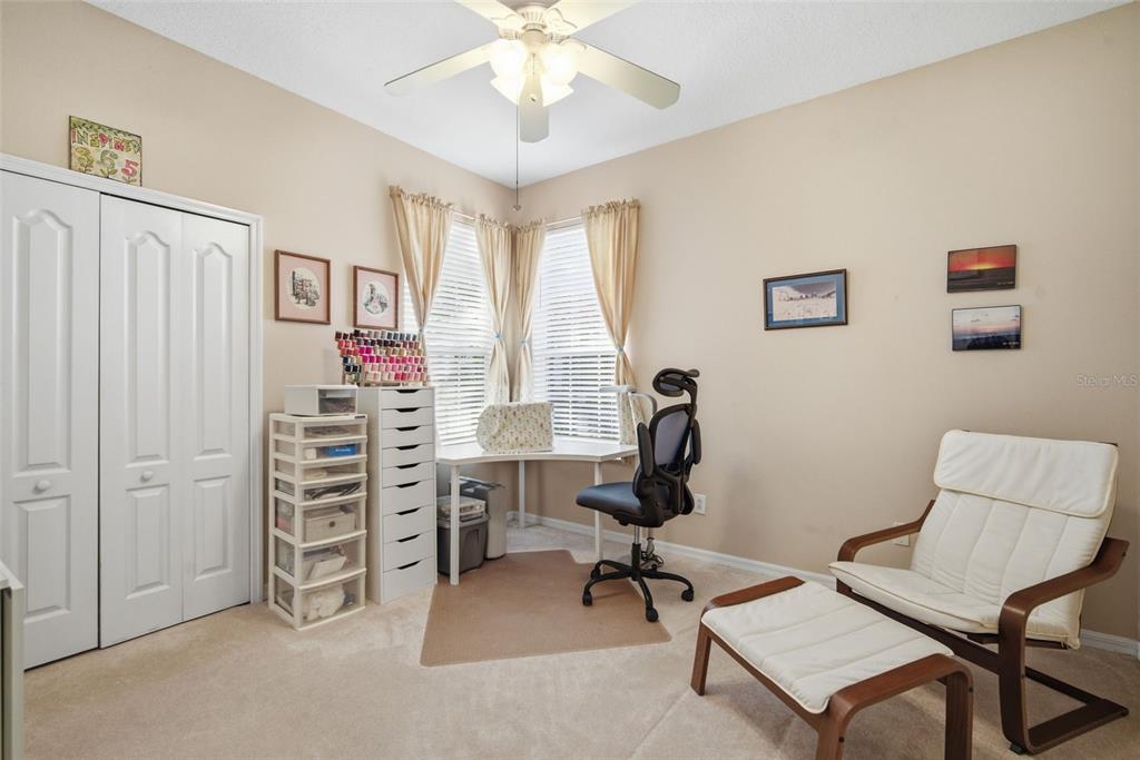 6057 Sandhill Ridge Drive Lithia, FL 33547 - Photo 36 of 83 a view of a workspace with lounge chair and a window