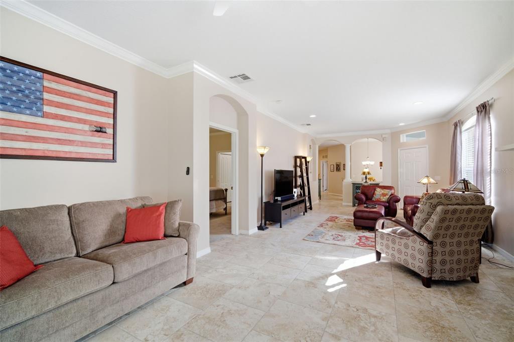 6057 Sandhill Ridge Drive Lithia, FL 33547 - Photo 40 of 83 a living room with furniture ceiling fan and a window