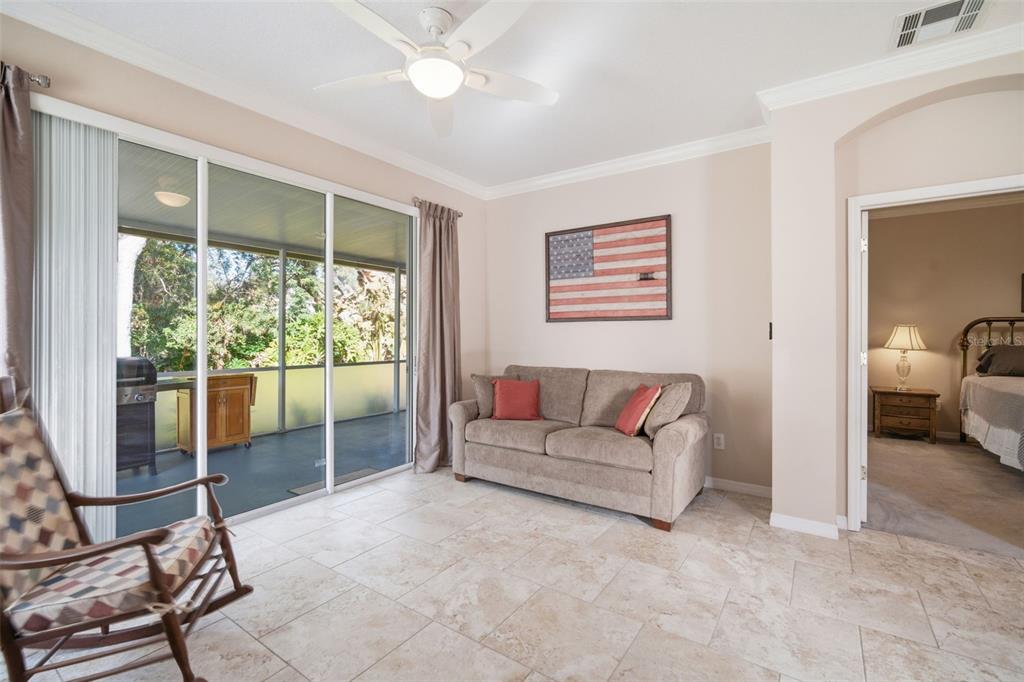 6057 Sandhill Ridge Drive Lithia, FL 33547 - Photo 43 of 83 a living room with furniture and a floor to ceiling window