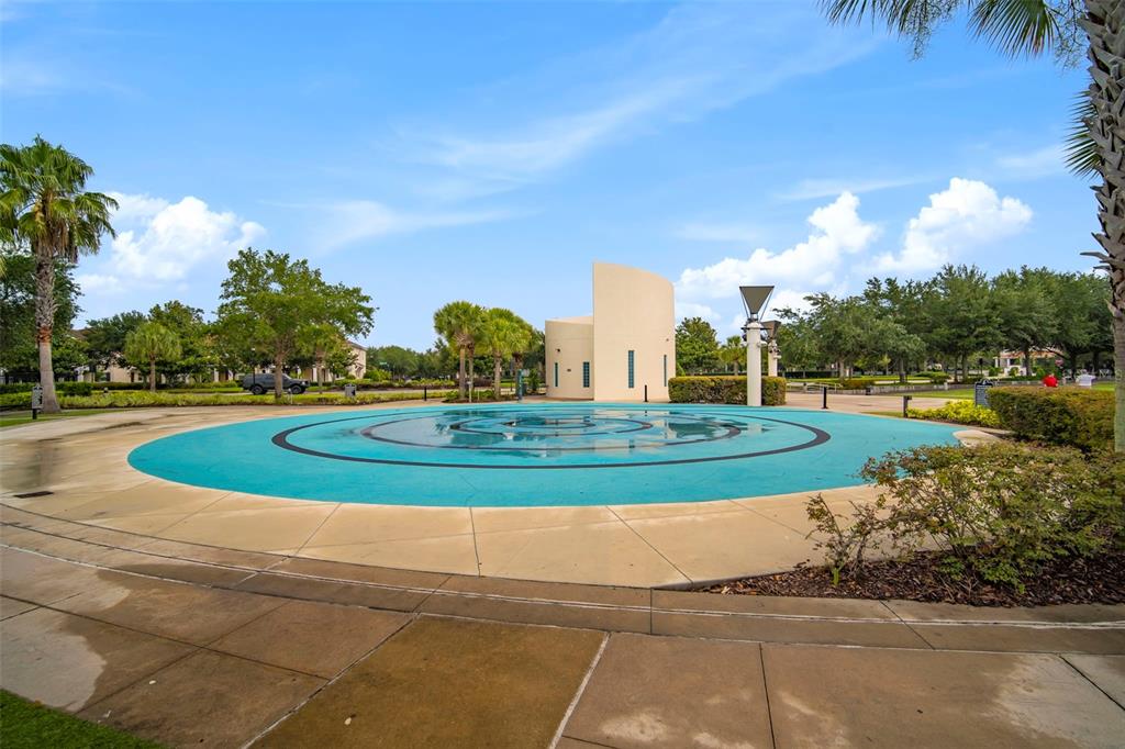 6057 Sandhill Ridge Drive Lithia, FL 33547 - Photo 74 of 83 a view of a fountain in front of a house