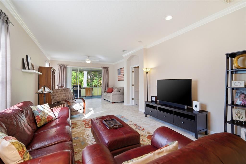 6057 Sandhill Ridge Drive Lithia, FL 33547 - Photo 10 of 83 a living room with furniture and a flat screen tv