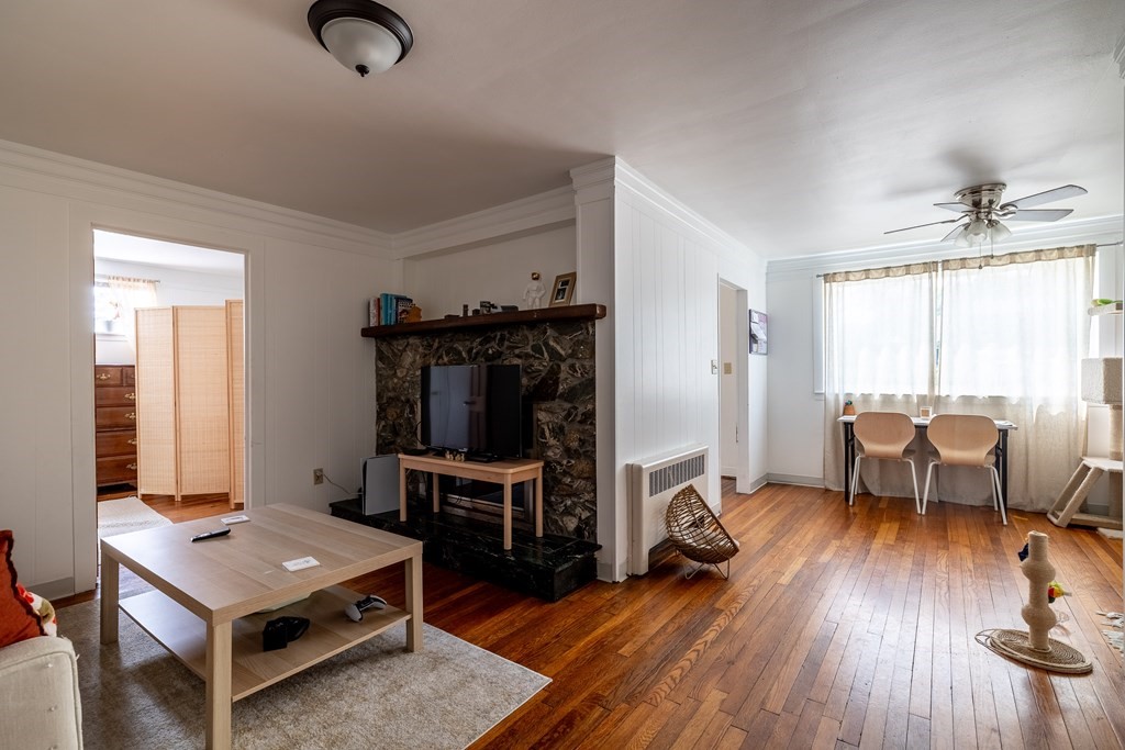 102 Mendon Street Blackstone, MA 01504 - Photo 12 of 41 a living room with furniture and a flat screen tv