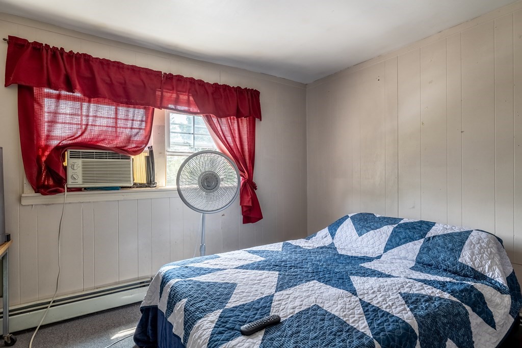 102 Mendon Street Blackstone, MA 01504 - Photo 20 of 41 a bedroom with a bed and a window