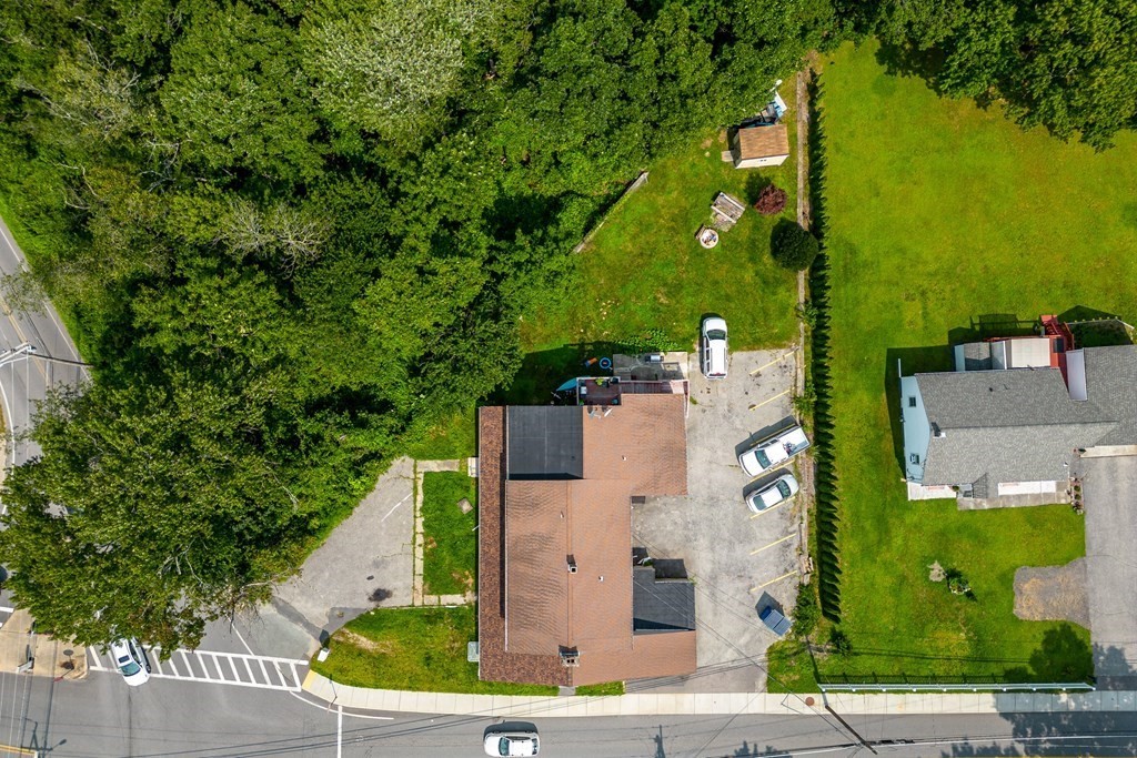 102 Mendon Street Blackstone, MA 01504 - Photo 2 of 41 an aerial view of a house with a yard and lake view