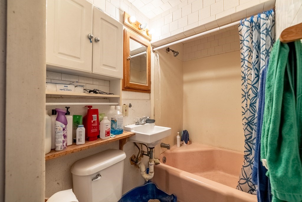 102 Mendon Street Blackstone, MA 01504 - Photo 21 of 41 a bathroom with a sink a toilet and a bathtub