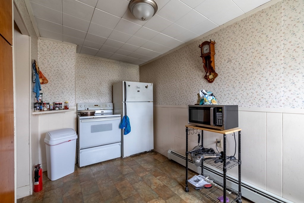 102 Mendon Street Blackstone, MA 01504 - Photo 22 of 41 a room with storage and utility
