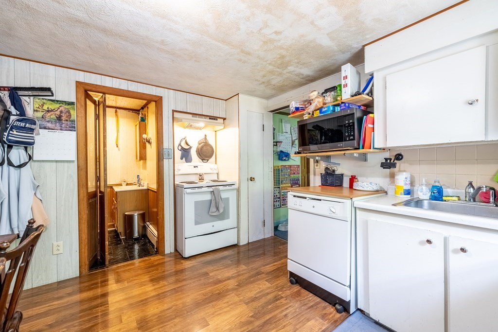 102 Mendon Street Blackstone, MA 01504 - Photo 27 of 41 a kitchen with a sink cabinets and wooden floor