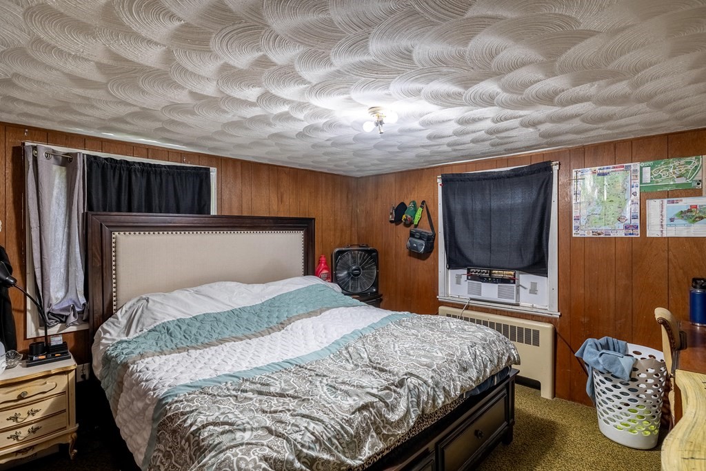 102 Mendon Street Blackstone, MA 01504 - Photo 29 of 41 a bedroom with a bed and a television