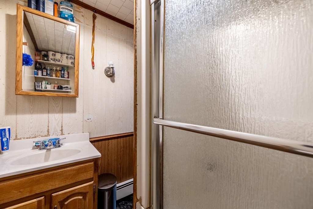 102 Mendon Street Blackstone, MA 01504 - Photo 30 of 41 a bathroom with a sink and a mirror