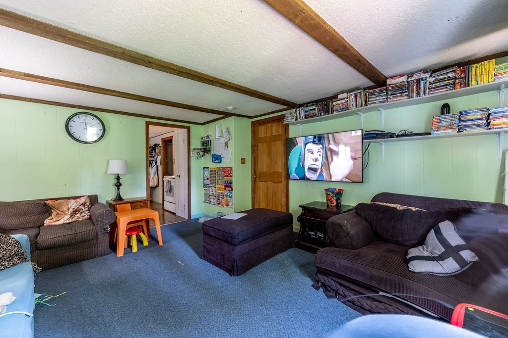 102 Mendon Street Blackstone, MA 01504 - Photo 32 of 41 a living room with furniture and a flat screen tv