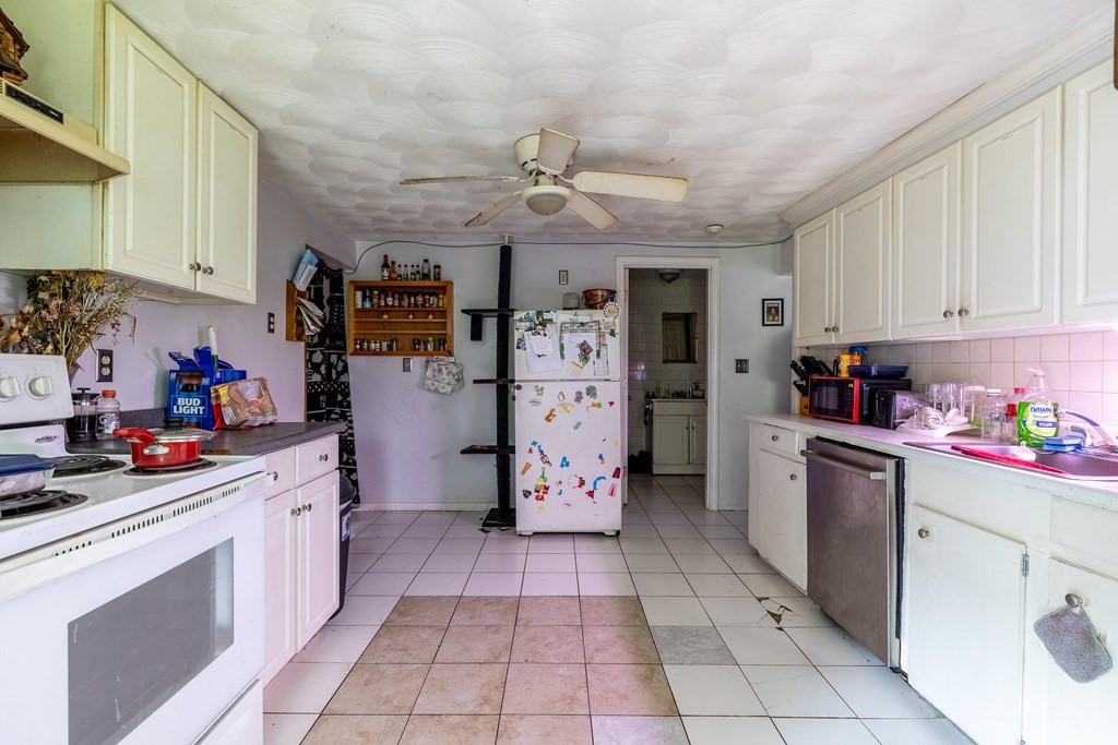 102 Mendon Street Blackstone, MA 01504 - Photo 33 of 41 a kitchen with a cabinets and window