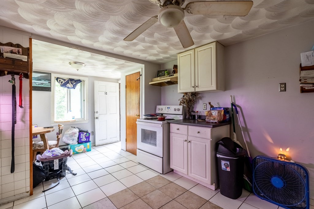 102 Mendon Street Blackstone, MA 01504 - Photo 34 of 41 a kitchen with furniture a refrigerator and a sink