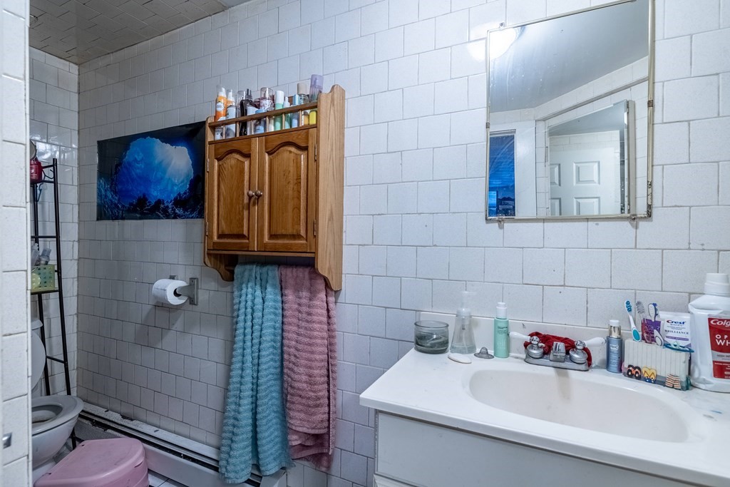 102 Mendon Street Blackstone, MA 01504 - Photo 35 of 41 a bathroom with a sink and a shower