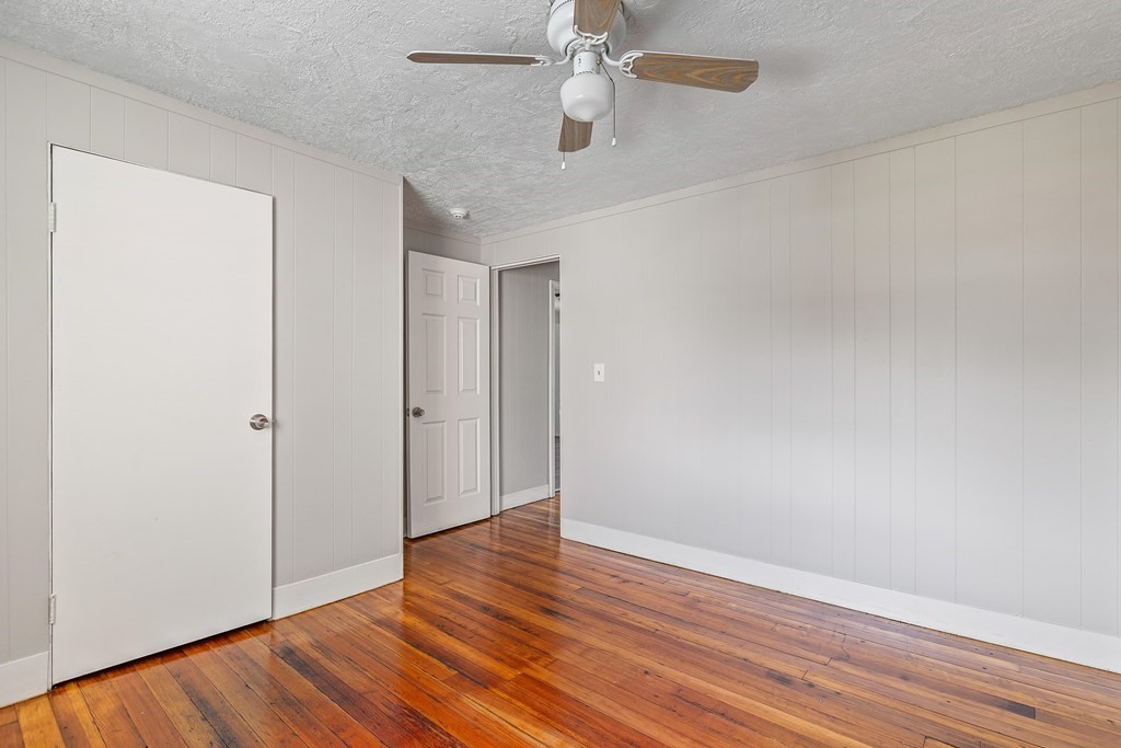 102 Mendon Street Blackstone, MA 01504 - Photo 6 of 41 a view of an empty room with wooden floor