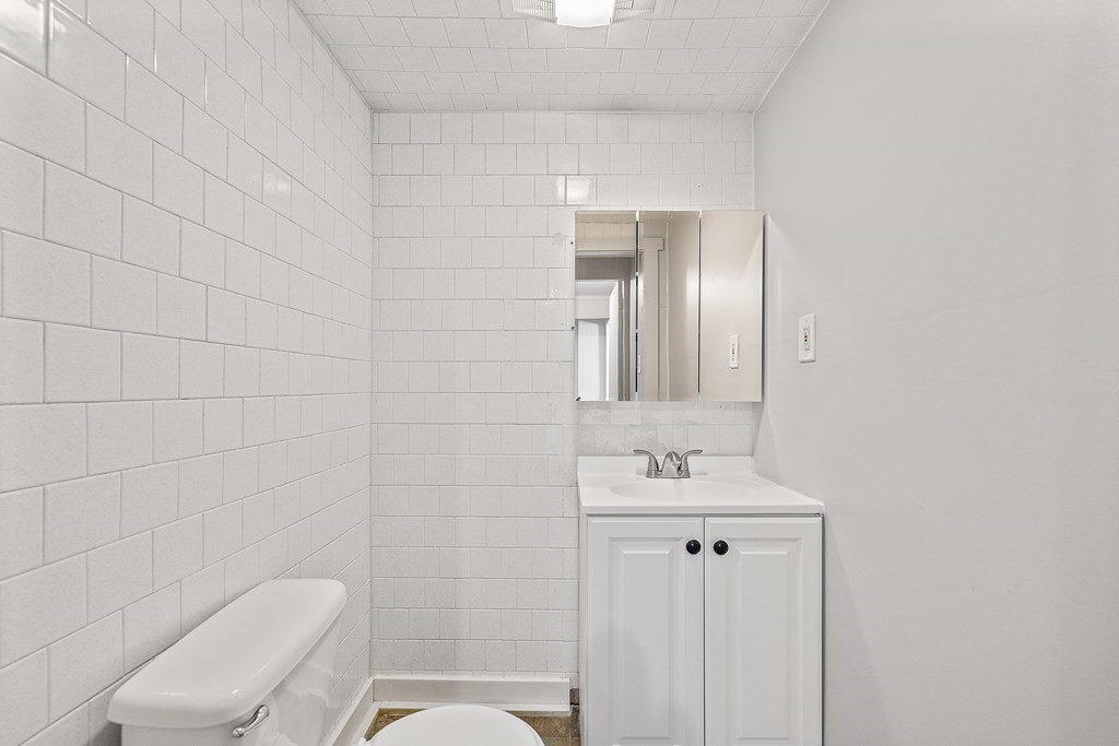 102 Mendon Street Blackstone, MA 01504 - Photo 7 of 41 a bathroom with a toilet sink shower and mirror