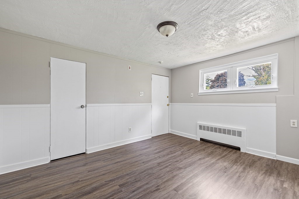 102 Mendon Street Blackstone, MA 01504 - Photo 8 of 41 wooden floor in an empty room
