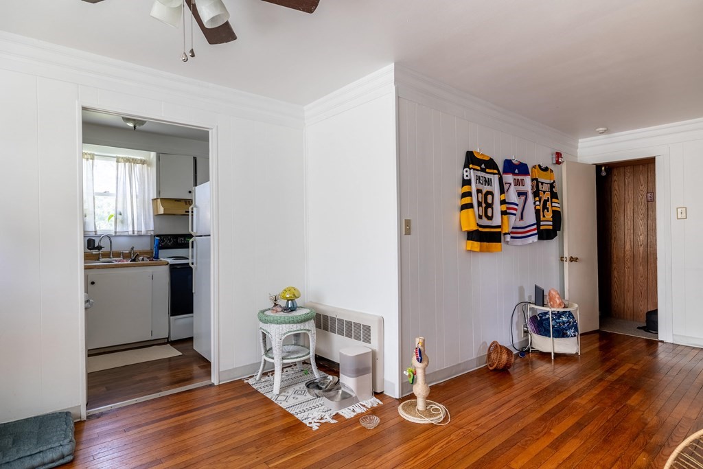 102 Mendon Street Blackstone, MA 01504 - Photo 10 of 41 a view of a workspace with furniture and wooden floor