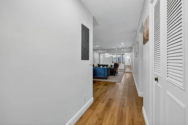 a view of a living room with a wooden floor