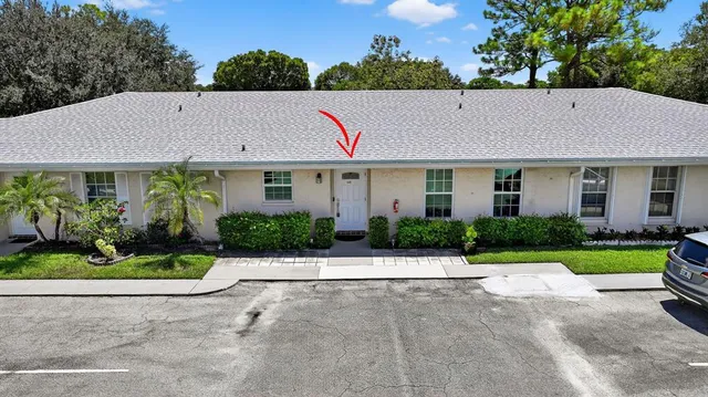a aerial view of a house with a yard