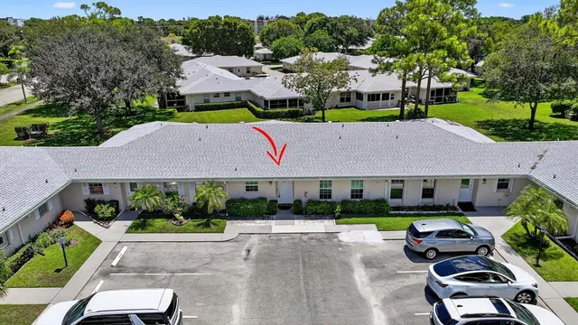 a aerial view of a house with garden space and street view