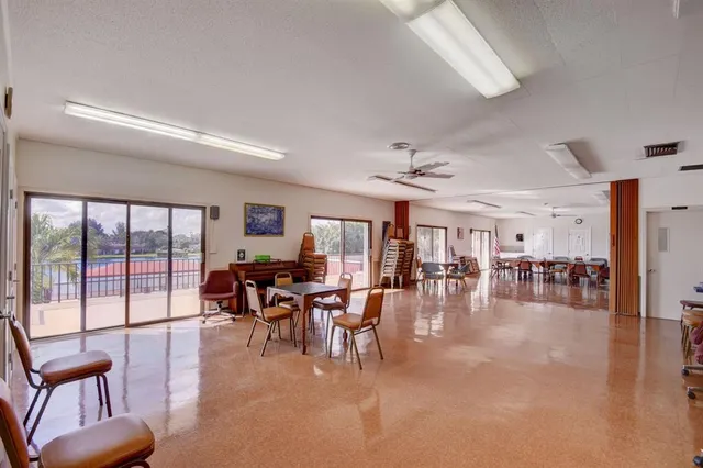 a dining room with furniture wooden floor a chandelier