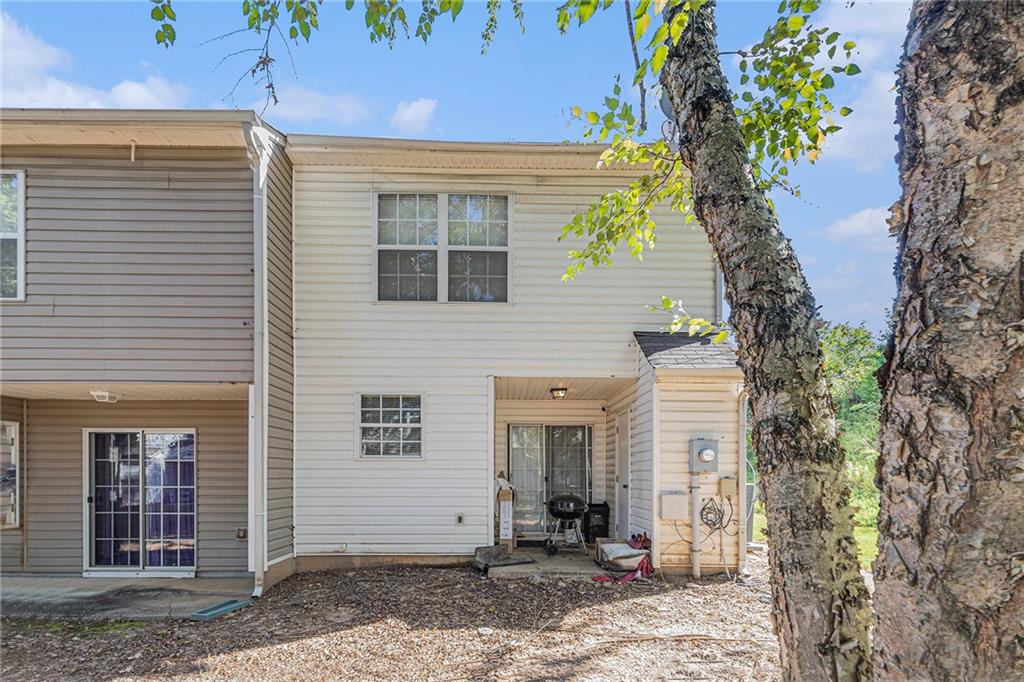 6536 Arbor Gate Drive Southwest, Unit 2 Mableton, GA 30126 - Photo 26 of 27 a view of a house with a tree