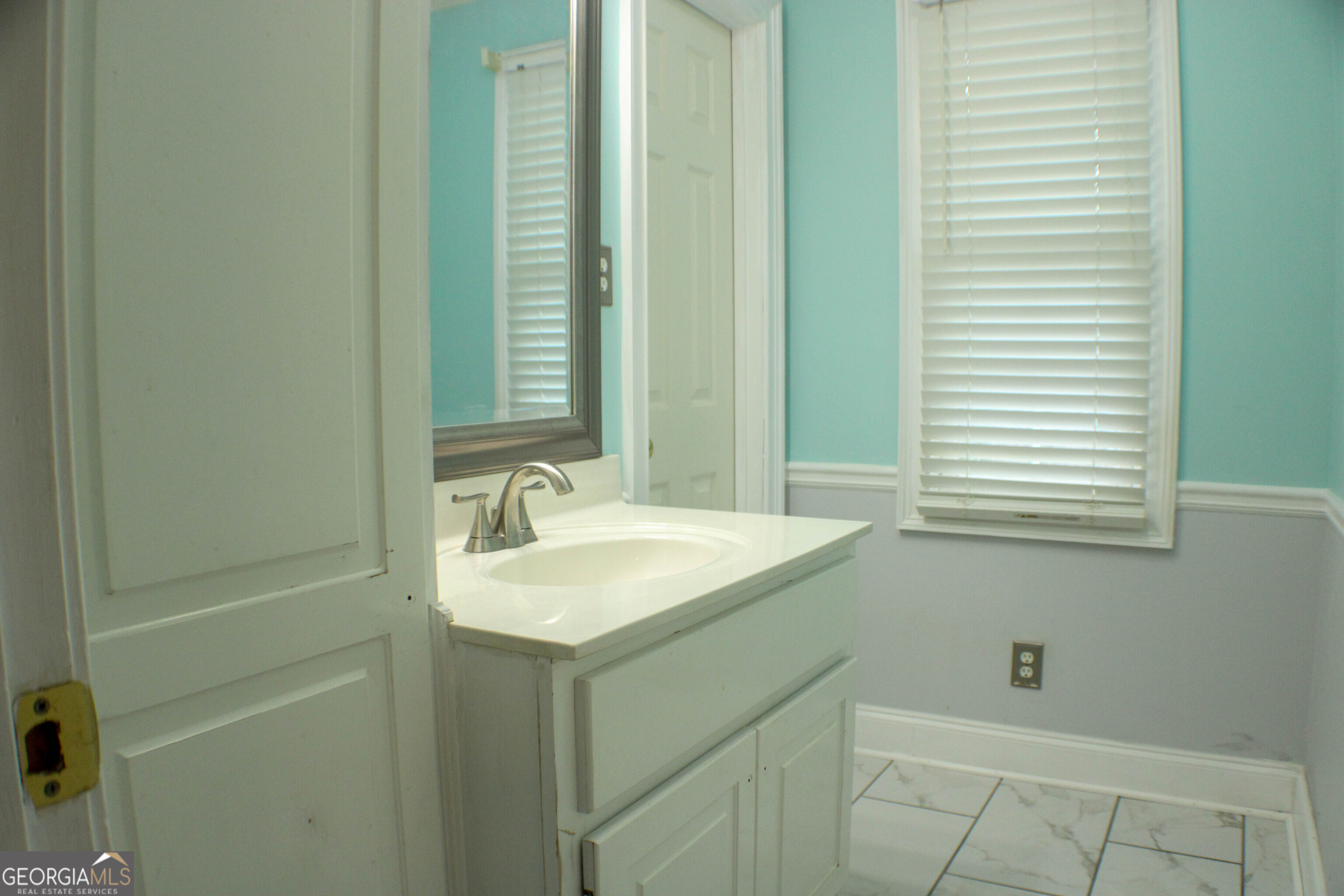 418 Flora Ext Avenue Rome, GA 30161 - Photo 19 of 29 a bathroom with a sink and a mirror