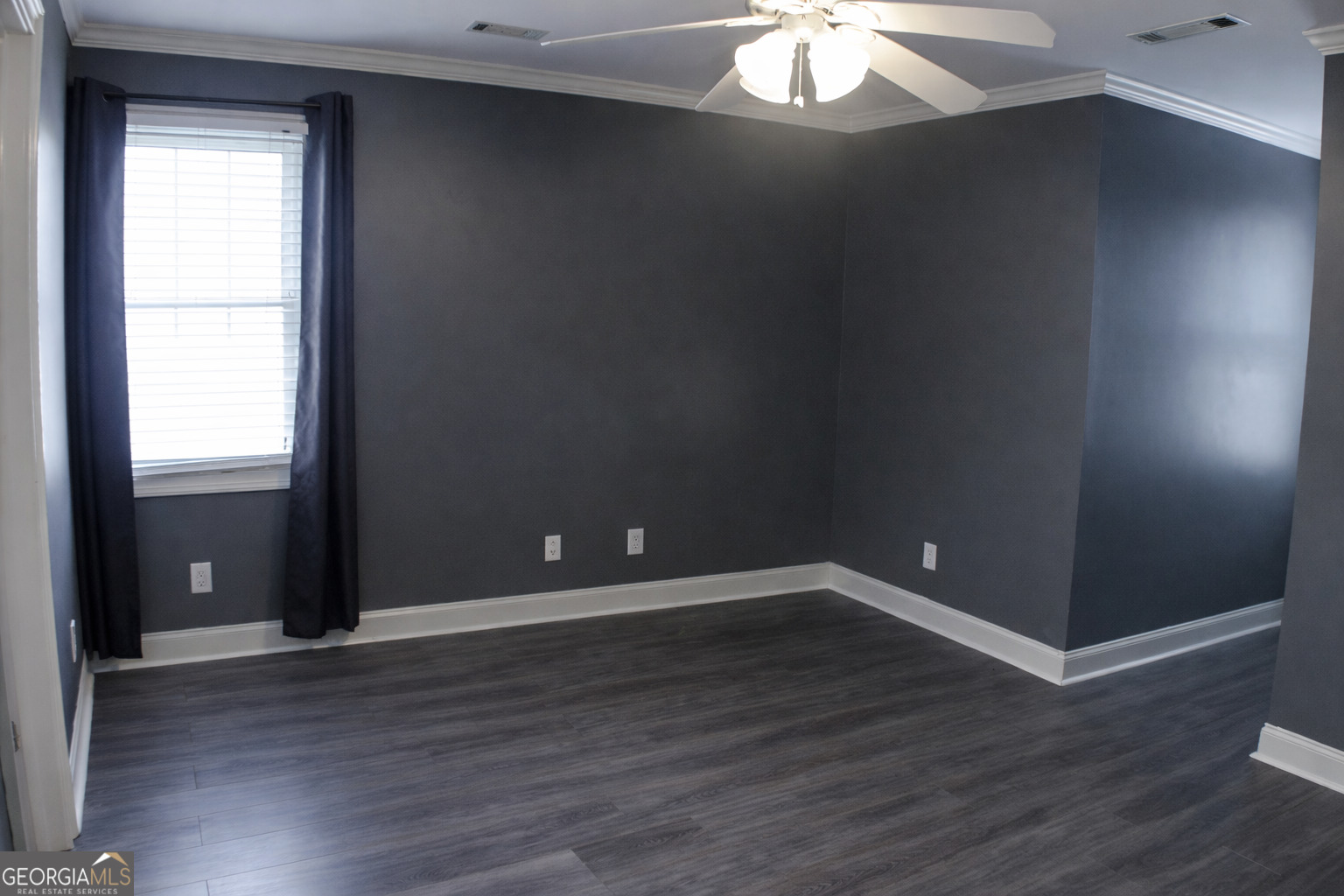 418 Flora Ext Avenue Rome, GA 30161 - Photo 21 of 35 an empty room with wooden floor and windows