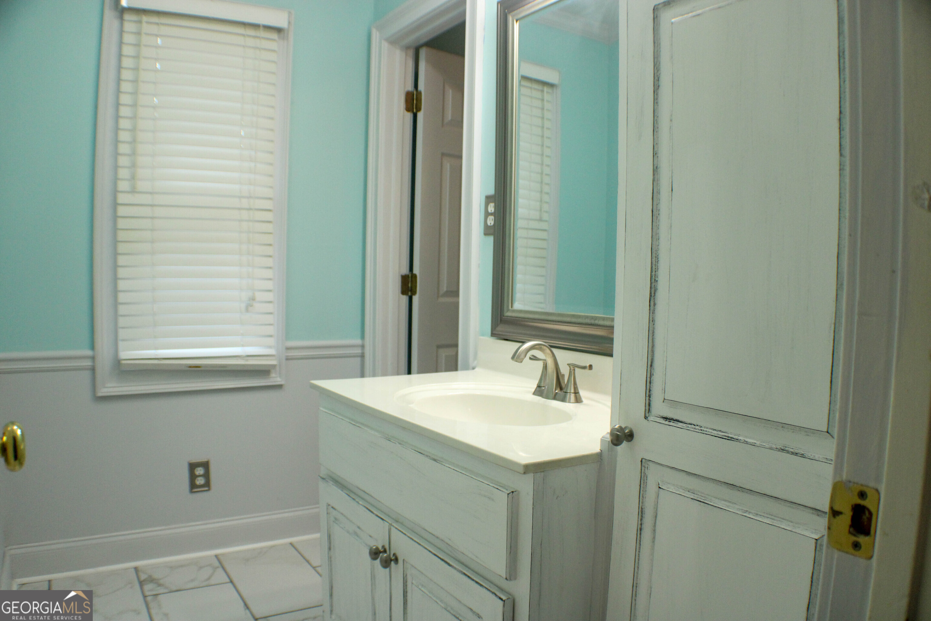 418 Flora Ext Avenue Rome, GA 30161 - Photo 21 of 29 a bathroom with a sink and a mirror