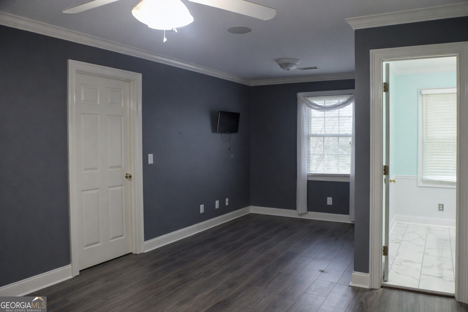 418 Flora Ext Avenue Rome, GA 30161 - Photo 22 of 29 an empty room with wooden floor and windows