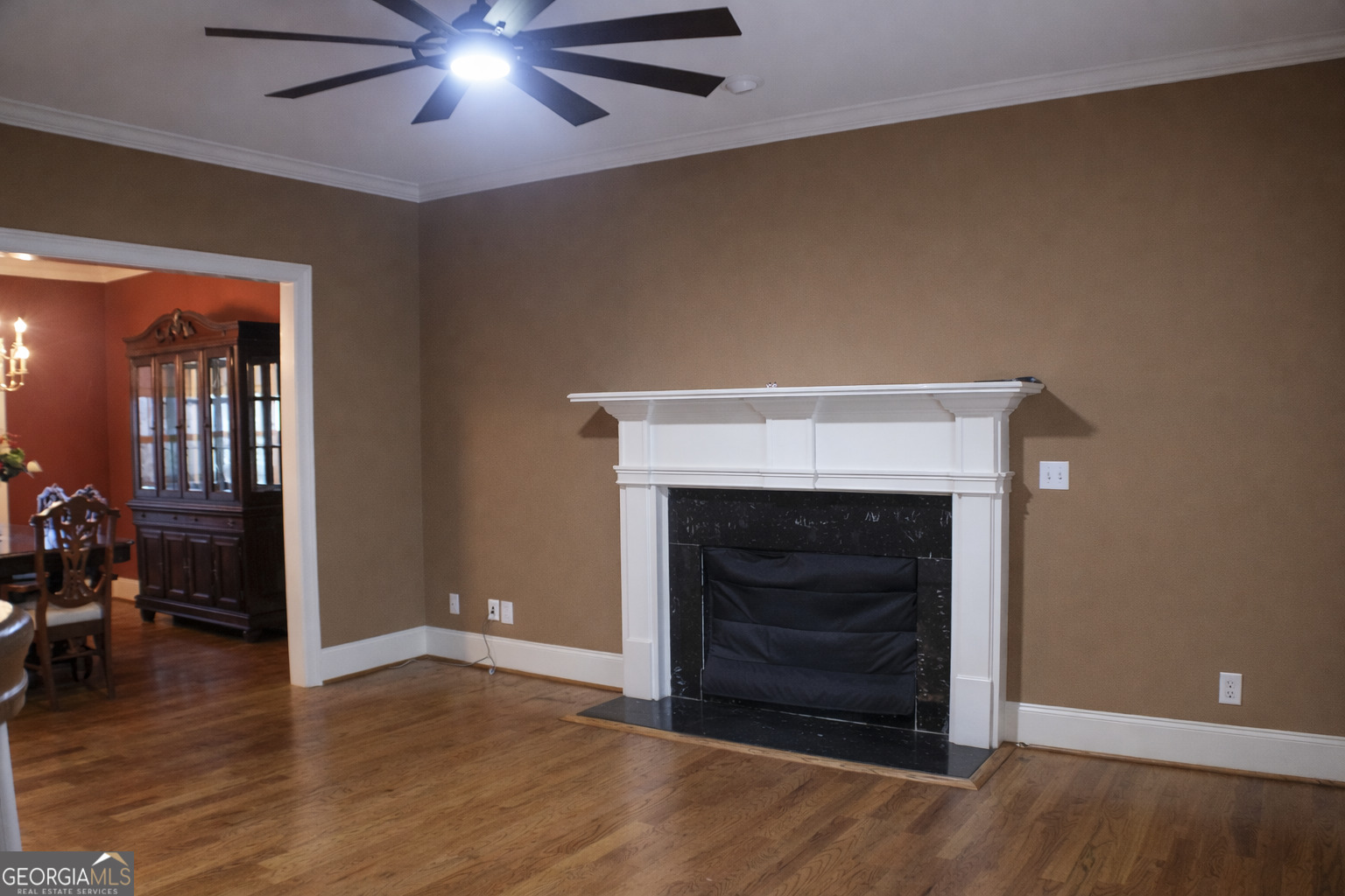 418 Flora Ext Avenue Rome, GA 30161 - Photo 6 of 29 a view of an empty room with wooden floor and a fireplace