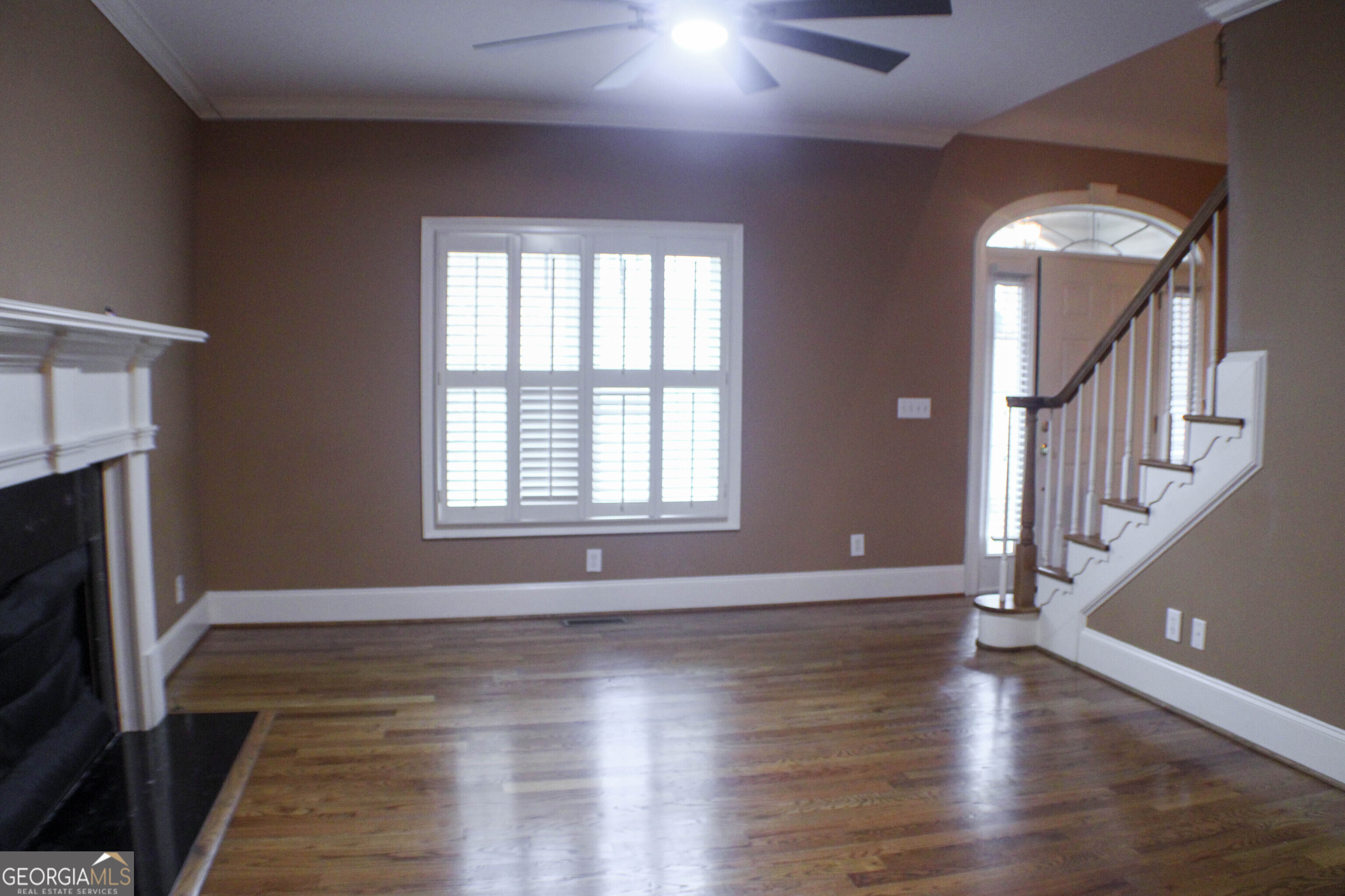 418 Flora Ext Avenue Rome, GA 30161 - Photo 7 of 29 a view of an empty room with wooden floor and a window