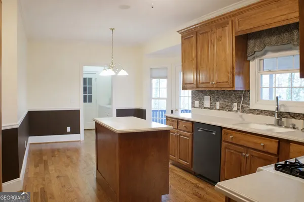 a kitchen with a sink and cabinets