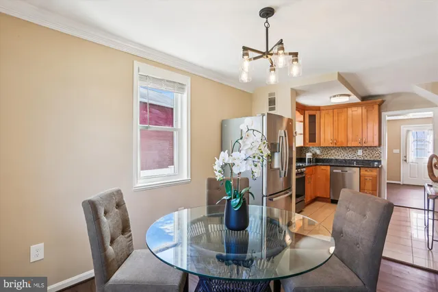 a view of a livingroom with wooden floor and a window
