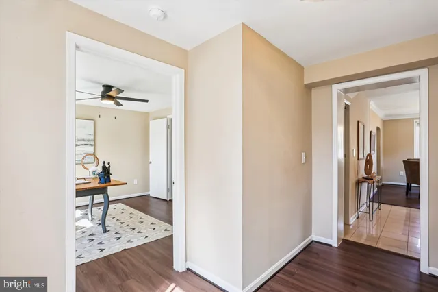 a kitchen with granite countertop stainless steel appliances a refrigerator stove top oven and sink