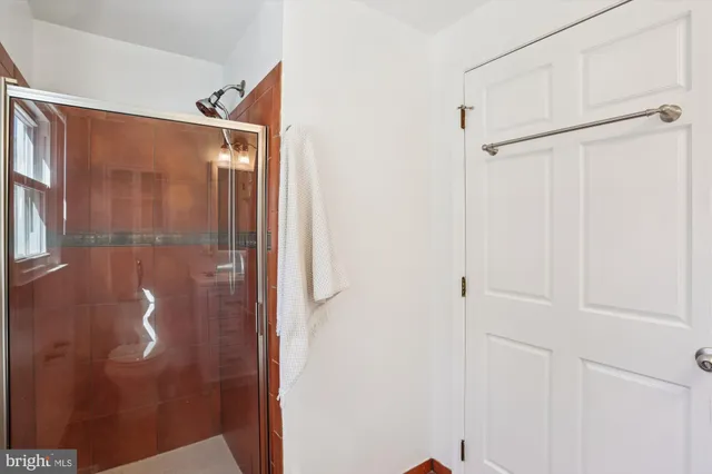 a bathroom with a sink toilet and a mirror