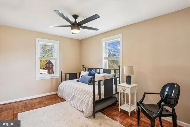 a bedroom with a bed and a couch