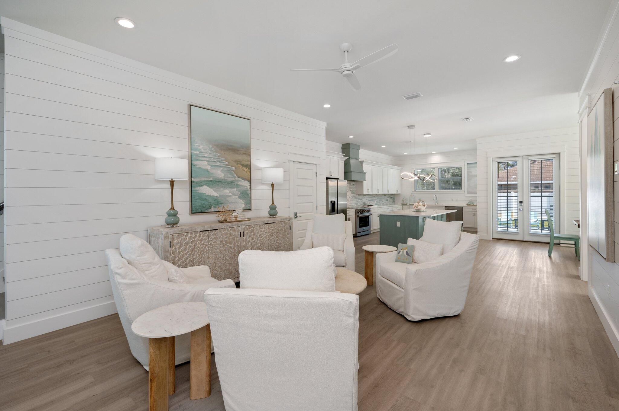 36 North Gulf Drive Santa Rosa Beach, FL 32459 - Photo 15 of 96 a living room with couches and kitchen view with wooden floor