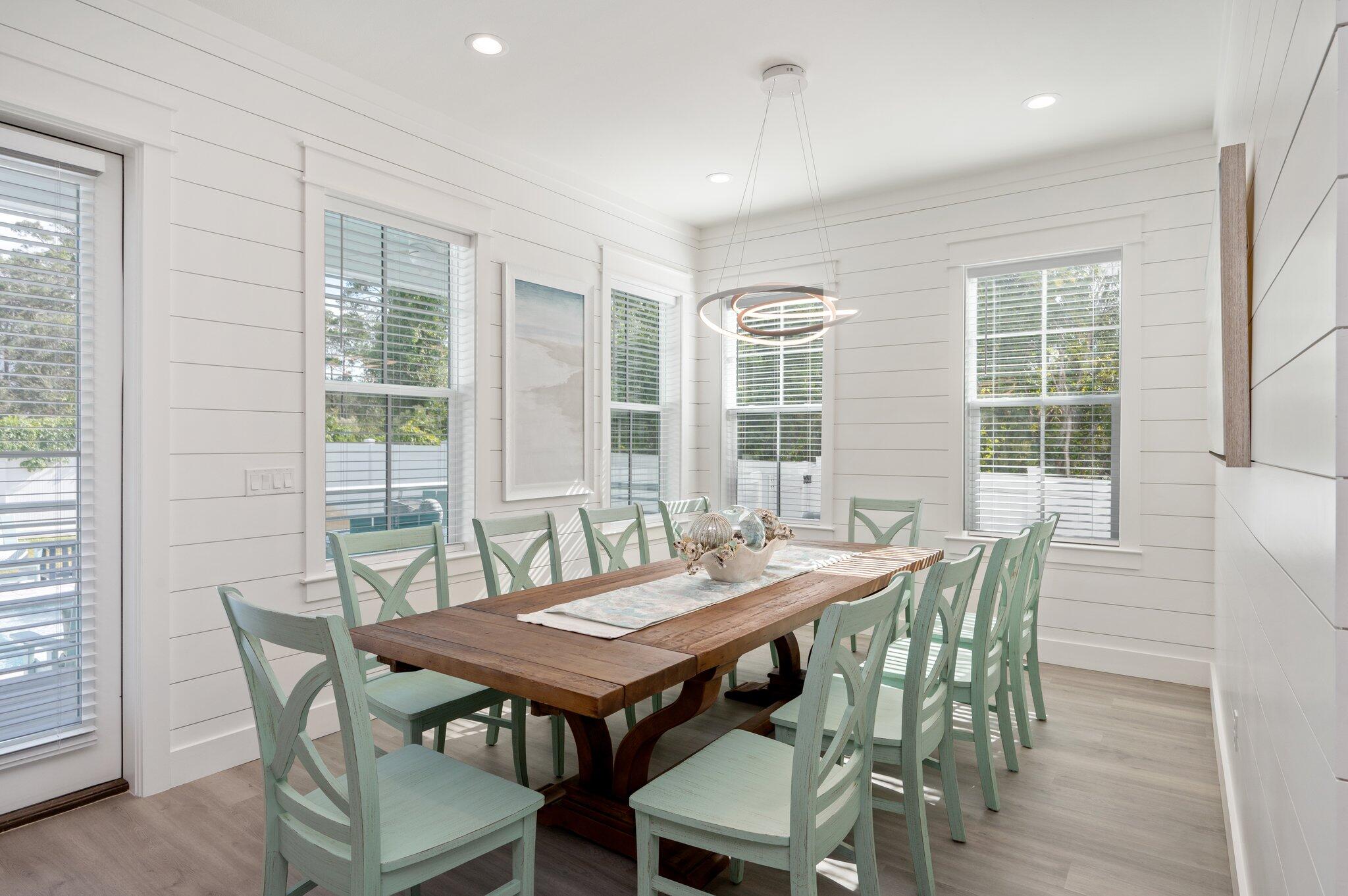 36 North Gulf Drive Santa Rosa Beach, FL 32459 - Photo 25 of 96 a view of a dining room with furniture and wooden floor