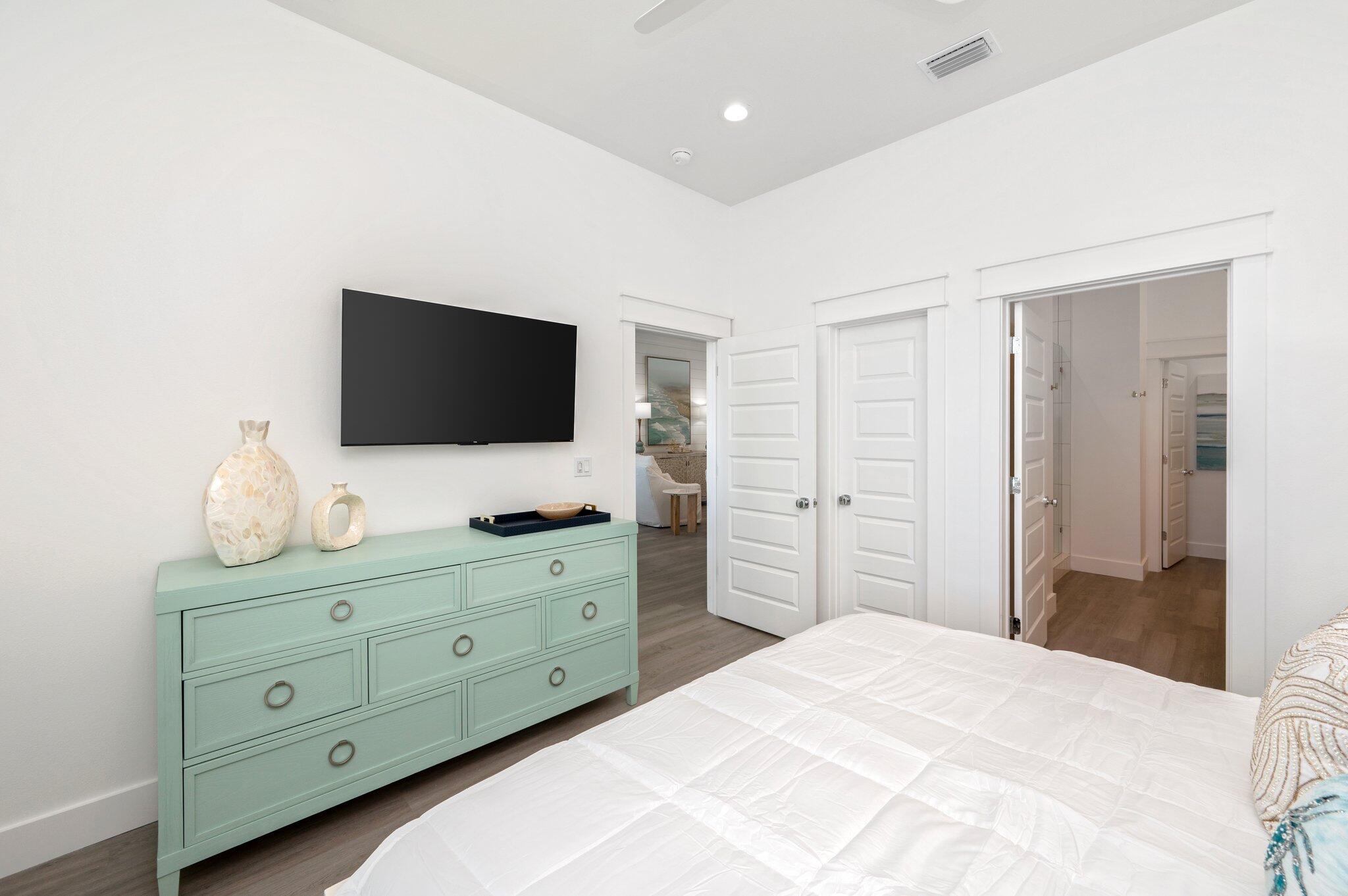 36 North Gulf Drive Santa Rosa Beach, FL 32459 - Photo 33 of 96 a bedroom with a bed and a flat tv screen in it