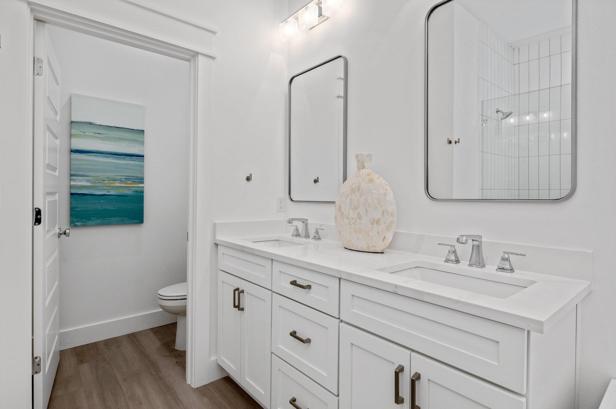 36 North Gulf Drive Santa Rosa Beach, FL 32459 - Photo 37 of 96 a bathroom with a double vanity sink mirror and toilet