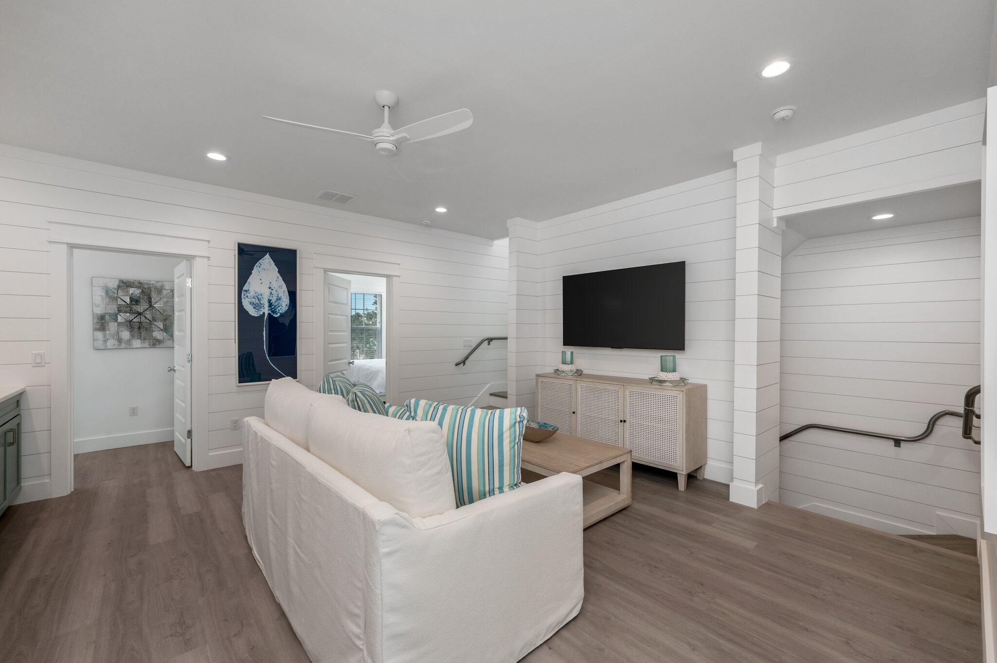 36 North Gulf Drive Santa Rosa Beach, FL 32459 - Photo 41 of 96 a living room with furniture wooden floor and a flat screen tv