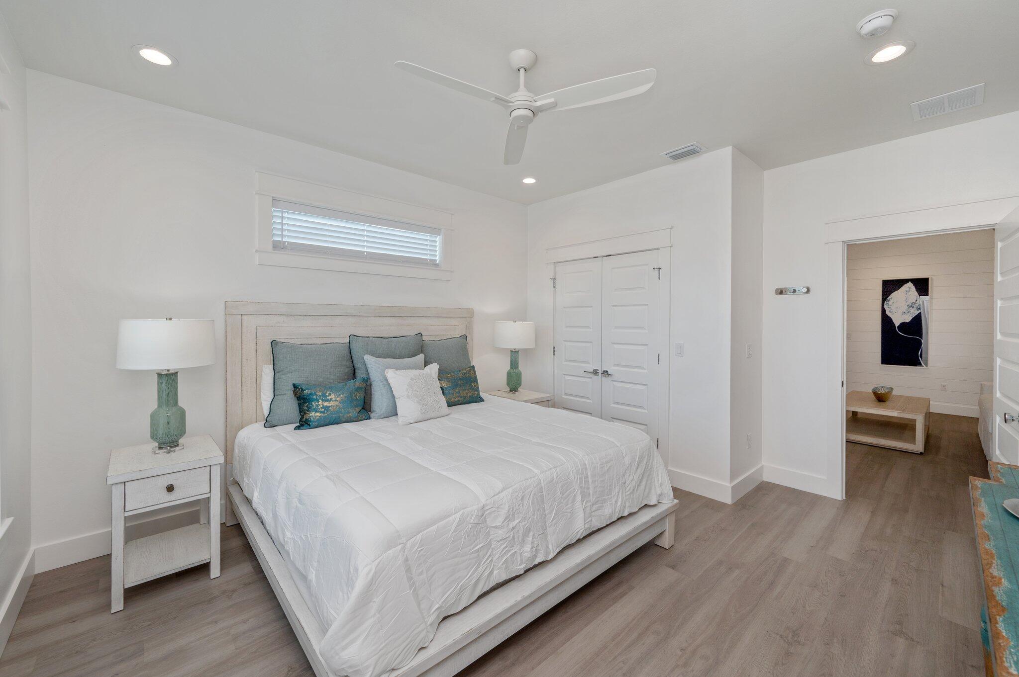 36 North Gulf Drive Santa Rosa Beach, FL 32459 - Photo 49 of 96 a bedroom with a bed and a lamp