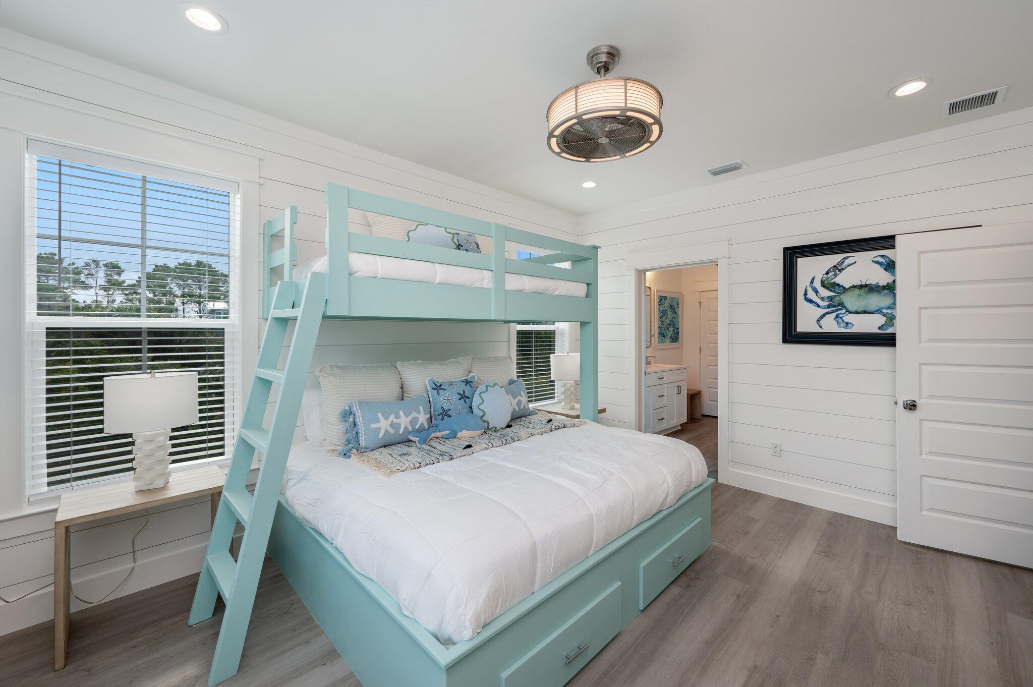 36 North Gulf Drive Santa Rosa Beach, FL 32459 - Photo 56 of 96 a bedroom with a large bed and a chandelier