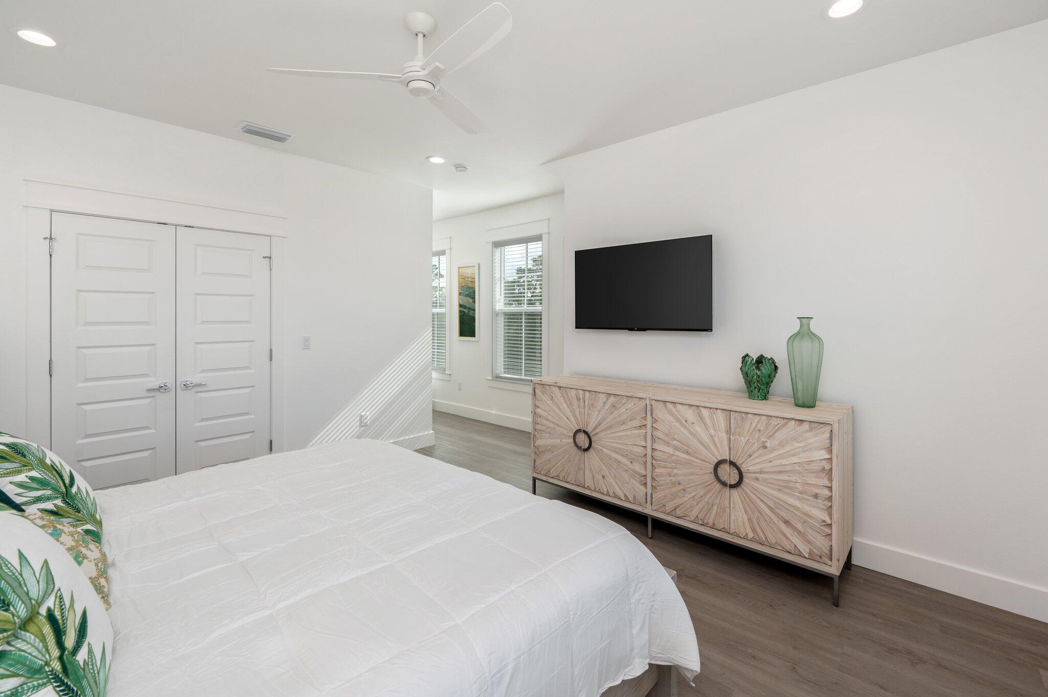 36 North Gulf Drive Santa Rosa Beach, FL 32459 - Photo 75 of 96 a bedroom with a bed and a flat tv screen on dresser