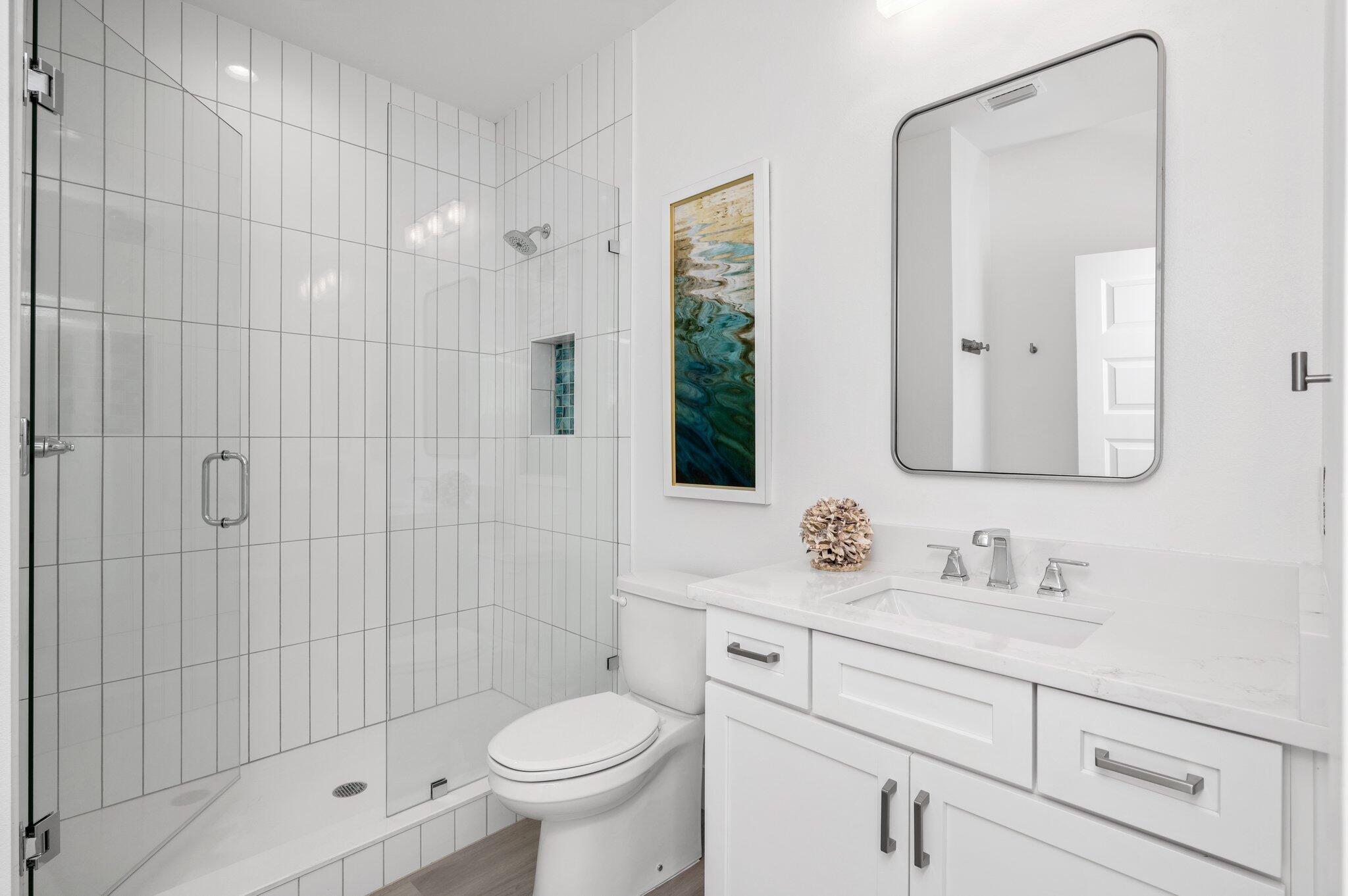 36 North Gulf Drive Santa Rosa Beach, FL 32459 - Photo 77 of 96 a bathroom with a shower sink vanity mirror and toilet