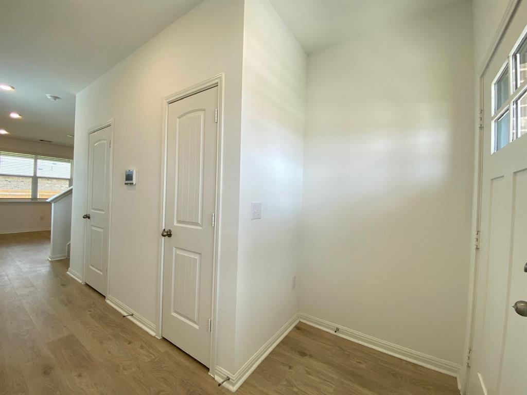 225 Saide Street Georgetown, TX 78626 - Photo 20 of 22 an empty room with wooden floor and windows