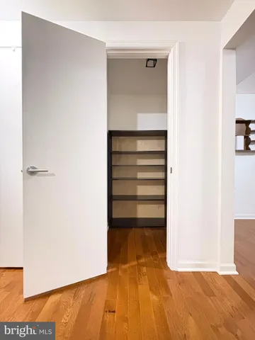 a view of a room with a wooden floor