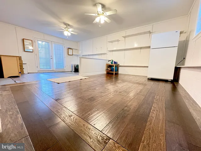 a view of hallway with couch and windows