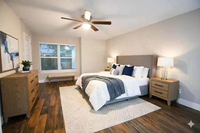 a bedroom with bed and window
